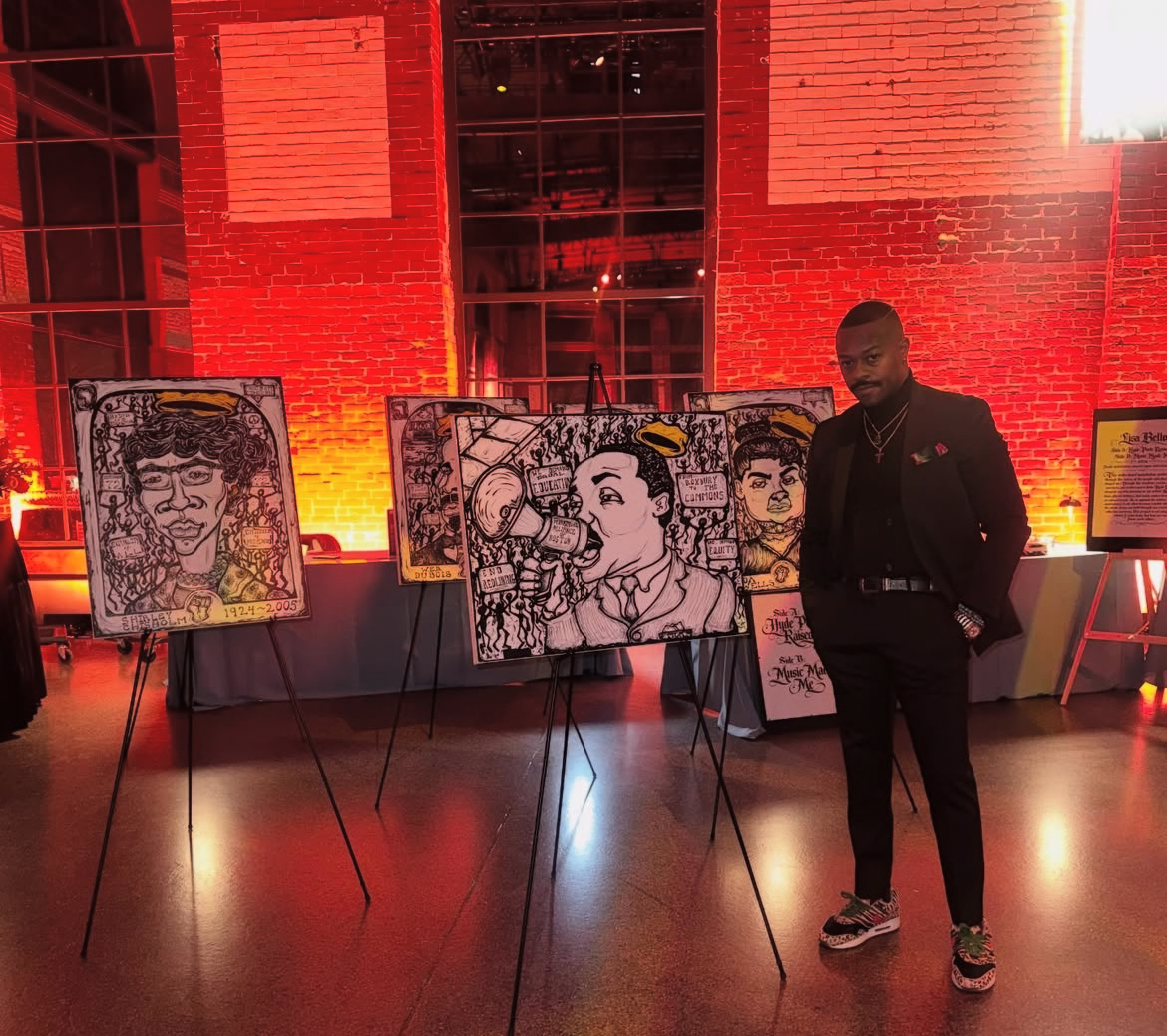 George Freeman (FromStreet2Canvas) with his Freedom Fighters painting series at a gallery installation